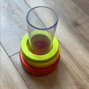 Lovevery Clear Tube with Stacking Rings toy. Colorful Stacking Glass Set